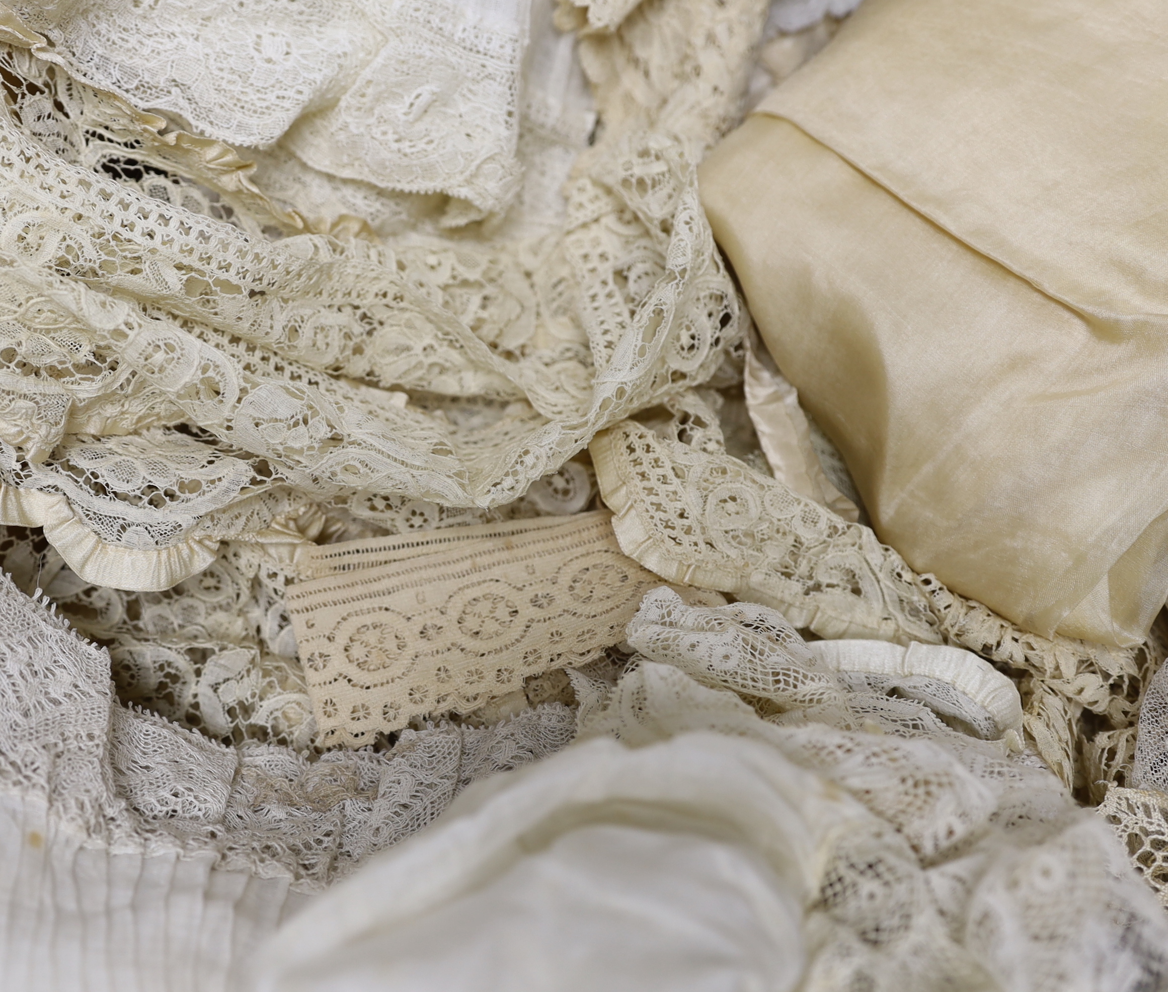 Mixed lace trimmings: a collection of Honiton bobbin lace trimming, a silk tape lace collar, various fine pleated gauze and lace edged trimmings, a silk skirt flounce, etc. A useful collection for making lace garments